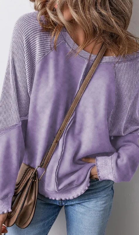 Exposed seam long sleeve sweater